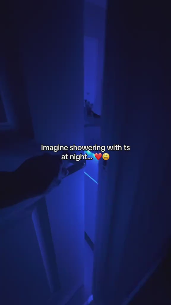 Load video: Bathroom glowing with LED strip lights creating spa-like atmosphere.